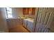 Laundry room features washer/dryer hookups, sink and plentiful storage at 9505 E Jenan Dr, Scottsdale, AZ 85260