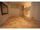Bright living room featuring high ceilings, travertine floors, and ample natural light at 9505 E Jenan Dr, Scottsdale, AZ 85260