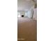 Bright living room with a fireplace and large windows for natural light at 9505 E Jenan Dr, Scottsdale, AZ 85260