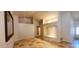 Bright living room with travertine floors and ample natural light at 9505 E Jenan Dr, Scottsdale, AZ 85260