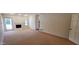 Bright living room featuring a fireplace and a glass patio door at 9505 E Jenan Dr, Scottsdale, AZ 85260