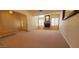 Spacious living room with fireplace, shutters and neutral carpet at 9505 E Jenan Dr, Scottsdale, AZ 85260