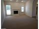 Bright living room featuring a fireplace and a glass patio door at 9505 E Jenan Dr, Scottsdale, AZ 85260