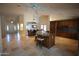 An open floorplan featuring a kitchen, dining area, and living space with travertine floors at 9505 E Jenan Dr, Scottsdale, AZ 85260