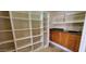 Functional pantry with custom shelves, cabinets, sink, and granite countertops at 9505 E Jenan Dr, Scottsdale, AZ 85260