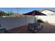 Outdoor patio with table, chairs and umbrella offers a relaxing seating area at 9505 E Jenan Dr, Scottsdale, AZ 85260