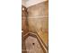 Shower stall with tiled walls and floors and a built-in bench at 9505 E Jenan Dr, Scottsdale, AZ 85260
