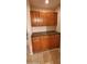 Wet bar area featuring rich wood cabinetry and countertop at 9505 E Jenan Dr, Scottsdale, AZ 85260