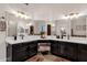 Dual vanity bathroom with modern fixtures and plenty of counter space at 9821 E Windrose Dr, Scottsdale, AZ 85260