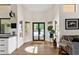 Inviting foyer with stylish flooring and a view of the pool at 9821 E Windrose Dr, Scottsdale, AZ 85260