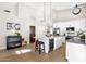 Contemporary kitchen features a large island with marble countertop, stainless steel appliances and wood door at 9821 E Windrose Dr, Scottsdale, AZ 85260