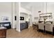 Spacious living area with dining room and gray cabinetry, ideal for modern living and entertaining guests at 9821 E Windrose Dr, Scottsdale, AZ 85260