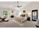 Comfortable main bedroom with a fireplace and plenty of natural light at 9821 E Windrose Dr, Scottsdale, AZ 85260