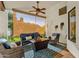 Cozy covered patio with comfortable seating and a ceiling fan, creating an inviting outdoor living space at 9821 E Windrose Dr, Scottsdale, AZ 85260