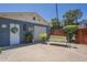 Backyard features a covered patio area with comfortable seating and a secure garage at 1003 E Mariposa St, Phoenix, AZ 85014