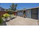 Backyard area offering a covered patio, rock landscaping, and a privacy fence for relaxation at 1003 E Mariposa St, Phoenix, AZ 85014