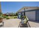 Backyard with a spacious patio area, mature trees, and low-maintenance landscaping with a secure garage at 1003 E Mariposa St, Phoenix, AZ 85014