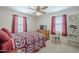 Cozy bedroom with bright windows, ceiling fan and simple furniture design at 1003 E Mariposa St, Phoenix, AZ 85014