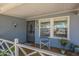 Charming front porch with a security door, desert decor, and a small seating area at 1003 E Mariposa St, Phoenix, AZ 85014
