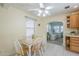 Charming kitchen featuring a breakfast nook with a ceiling fan, and a view into the living area at 1003 E Mariposa St, Phoenix, AZ 85014