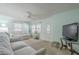 Comfortable living room with neutral carpet, bright walls, and a large window for natural light at 1003 E Mariposa St, Phoenix, AZ 85014