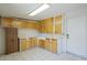 Room featuring tile flooring and light wood cabinets, perfect for storage and organization at 1003 E Mariposa St, Phoenix, AZ 85014