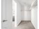 Clean and spacious walk-in closet with carpet flooring and installed clothes racks at 10284 E Shallow Canyon Rd, San Tan Valley, AZ 85143