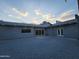 Wide backyard featuring gravel, minimalist landscaping, and a modern gray stucco home at 10637 N 16Th Ave, Phoenix, AZ 85029