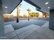 Enclosed backyard with minimalist desert landscaping with gravel, palms, and block wall at 10637 N 16Th Ave, Phoenix, AZ 85029