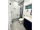 Bathroom with glass shower, rock floor, and modern vanity at 10637 N 16Th Ave, Phoenix, AZ 85029