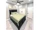 Bedroom with a black bed frame, leaf-themed decor, and a ceiling fan at 10637 N 16Th Ave, Phoenix, AZ 85029
