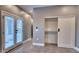 Bedroom with a sliding closet door, and glass doors with blinds for lots of light at 10637 N 16Th Ave, Phoenix, AZ 85029