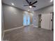 Spacious bedroom with tile floors, ceiling fan, and closet at 10637 N 16Th Ave, Phoenix, AZ 85029