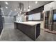 Open-concept view of a modern kitchen featuring a marble island and stainless steel appliances at 10637 N 16Th Ave, Phoenix, AZ 85029