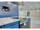 Modern kitchen features stainless steel appliances, a large island with quartz countertops, and a built-in oven at 10637 N 16Th Ave, Phoenix, AZ 85029