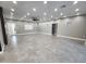 Spacious living room featuring recessed lighting, gray tile floors, and a large window providing natural light at 10637 N 16Th Ave, Phoenix, AZ 85029