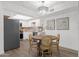 Charming dining area adjacent to the kitchen, illuminated by a modern chandelier at 1075 E Chandler Blvd # 212, Chandler, AZ 85225
