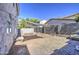 Spacious backyard with gravel, block wall, and shade sails at 1107 E La Salle St, Phoenix, AZ 85040