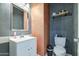Bathroom features stylish vanity, framed mirror and convenient toilet location at 1107 E La Salle St, Phoenix, AZ 85040