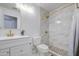 Well-lit bathroom with updated fixtures, vanity, and walk-in shower with gold accents at 1107 E La Salle St, Phoenix, AZ 85040