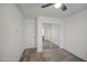 Carpeted bedroom features a ceiling fan and a closet with mirrored doors for extra light at 1107 E La Salle St, Phoenix, AZ 85040