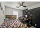 Bedroom with ceiling fan and desk area, providing a comfortable and functional space at 1107 E La Salle St, Phoenix, AZ 85040