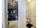 Large walk-in closet and half-bath combo offering lots of space for clothes and accessories at 1107 E La Salle St, Phoenix, AZ 85040
