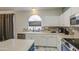 A bright kitchen featuring stone floors, stainless appliances, and lots of storage at 1107 E La Salle St, Phoenix, AZ 85040