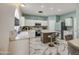Bright kitchen featuring stone floors, stainless appliances, a central island, and a breakfast bar at 1107 E La Salle St, Phoenix, AZ 85040