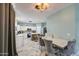 A bright kitchen features marble floors, a central island, and a dining area with luxury chairs at 1107 E La Salle St, Phoenix, AZ 85040