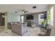 Modern living room with marble floors, neutral-toned furnishings, and a large TV at 1107 E La Salle St, Phoenix, AZ 85040