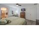 A comfortable main bedroom with adjoining vanity, ceiling fan, and lots of natural light at 1107 E La Salle St, Phoenix, AZ 85040