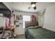 Main bedroom featuring a fan and decorated with personal decorations and natural light at 1107 E La Salle St, Phoenix, AZ 85040