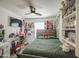 Main bedroom is decorated with personal touches, a ceiling fan, and natural light at 1107 E La Salle St, Phoenix, AZ 85040
